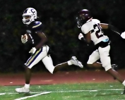 Chamblee's Larry Harris outraces Tucker's Tewroh Sungbeh into the end zone. (Photo by Mark Brock)