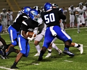 Stephenson running back Devin Ingram (with ball) races behind a block by teammate O'Shea Stroman (50) during the Jaguars 18-13 Region 6-4A win over Westminster. (Photo by Mark BrocK)