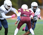 Chapel Hill's Robert Alexander (5) cuts back against Tucker's John Rodriguez (14) during Chapel Hill's 6-0 Trail to the Title semifinal victory on Saturday. Alexander scored the only touchdown of the game on an eight-yard run with 7:14 to play. (Photo by Bruce James -- Unforgettable Moments)