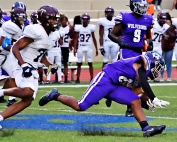 Tucker's Christopher Jackson (7), shown here in pursuit of a Miller Grove running back, is one of a tandem of defensive ends, including Nakobi Spurrier, that are a key to the Tigers' defense. (Photo by Mark Brock)