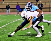 Cedar Grove senior linebacker and University of Louisville commit Adonijah Green (9) sacks Calvary Day quarterback Jake Mecklinger (4). (Photo by Mark Brock)