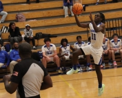 Chamblee's Zayd Fisher (11) drives to the basket for two of his 12 fourth-quarter points in a 70-64 loss to Decatur on Tuesday night. (Photo by Mark Brock)