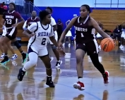 Towers Malayla Coleman (1) drives against Redan's Londyn Felder (2) during Redan's Region 6-2A 49-24 win. (Photo by Mark Brock)