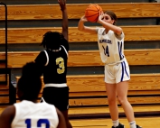 Chamblee's Sophia Marek (14) hot hand from three-point land hitting for seven threes and scoring 20 points to lead the Lady Bulldogs to a 48-25 home win over the Lithonia Lady Bulldogs in Region 4-5A girls' basketball action. (Photo by Mark Brock)