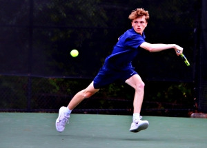 Dunwoody's Bobby Kitchin chases down a shot during his 3-hour and 45-minute marathon match he won 6-2, 4-6, 7-6 (7-3) to send the Wildcats to the Class 6A state semifinals. (Photo by Mark Brock)