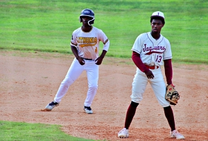 Lithonia's Quintez Lucas (left) checks for a throw as Maynard Jackson's Jack Defoer defends at first base during the 3rd annual DCSD/APS Senior All-Star Baseball Classic at Redan. (Photo by Mark Brock)