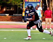 Towers' defensive lineman Jacquez Harris scooped up a bad punt in the first quarter for a 43-yard touchdown return to put the Titans up 6-0 early in their eventual 35-18 loss to Landmark Christian on Thursday night. (Photo by Mark Brock)