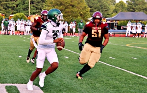 Arabia Mountain senior quarterback Julian Shanks (with ball) leads the Rams into the third ever meeting against the Lakeside Vikings on Thursday (tonight) at Godfrey Stadium. (Photo by Mark Brock)