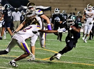 Arabia Mountain's Jordan Walker (6) avoids a pair of Viking defenders on his way to a receiving touchdown. He also had a 92-yard kickoff return in the tough 51-50 loss. (Photo by Mark Brock)