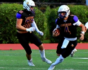 Lakeside quarterback Kyle Davis (4) runs past lineman William Maugnon (52) in action against Berkmar last season. Davis led the Vikings to a 25-21 come-from-behind win over Macon County with a QB sneak in the fourth quarter. (Photo by Mark Brock)