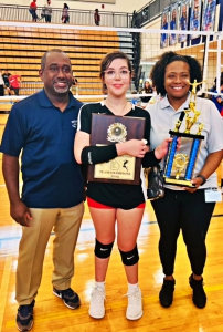 DeKalb Athletics Middle School Coordinator Paris Burd (left) and DeKalb Athletics Executive Director Myss Jelks (right) present Druid Hills' Alana Umlauf (center) with the Most Valuable Player award for the Slam Tournament.