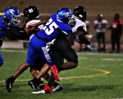 Stephenson's Tyler Little (25) gets the sack on Mt. Zion quarterback Desmund Thomas during a tough 20-14 loss on Friday. (Photo by Mark Brock)