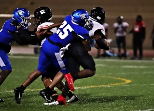 Stephenson's Tyler Little (25) gets the sack on Mt. Zion quarterback Desmund Thomas during a tough 20-14 loss on Friday. (Photo by Mark Brock)