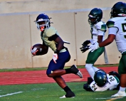 Southwest DeKalb's Josh Jones splits Clarkston defenders on the way to a 44-yard touchdown reception on Southwest DeKalb's first offensive play of the game. (Photo by Mark Brock)