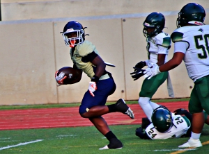 Southwest DeKalb's Josh Jones splits Clarkston defenders on the way to a 44-yard touchdown reception on Southwest DeKalb's first offensive play of the game. (Photo by Mark Brock)