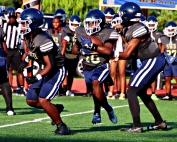 Southwest DeKalb's Tamir Rudolph (7) lead blocks for Joshua Jones (10) as he takes a handoff from quarterback Braylon Carter (2) during preseason action against Columbia. (Photo by Mark Brock)