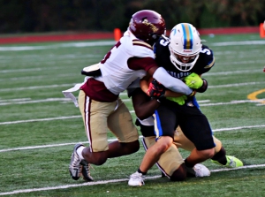 Tucker defensive back Dijmon McClendon (left) tackles Chamblee's George Ross during Tucker's win two weeks ago. (Photo by Mark Brock)