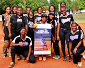 The Miller Grove Wolverine softball team celebrated teammate Amiyah Morrison's school record for strikeouts before their win over Columbia on Tuesday night. (Photo by Mark Brock)