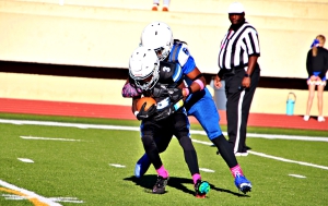 Stephenson's Zahkir Muhammed (6) tackles Chamblee's Antwan Middleton (3) for a loss during Stephenson's 20-0 first round win in the Trail to the Title middle school football playoffs. (Photo by Mark Brock)