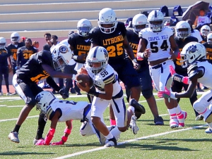 Chapel Hill's Cayden Whitlow (56) picks off a tipped pass during the Panthers' 20-14 win over previously undefeated Lithonia in the first round of the Trail to the Title playoffs. (Photo by Mark Brock)