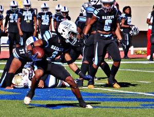 Cedar Grove's Zack Bell (1) runs against the Champion Chargers in first round action of the Trail to the Title Playoffs. Bell threw for four touchdowns and ran for two more in a semifinal win over Stephenson last weekend. (Photo by Mark Brock)