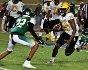 Lithonia running back ALbert Gooding (20) cuts away from Clarkston defender Kaedon Ferris (22) for nice gain. Gooding finished with 112 yards rushing and two touchdowns in the 54-0 Lithonia win. (Photo by Mark Brock)