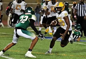 Lithonia running back ALbert Gooding (20) cuts away from Clarkston defender Kaedon Ferris (22) for nice gain. Gooding finished with 112 yards rushing and two touchdowns in the 54-0 Lithonia win. (Photo by Mark Brock)