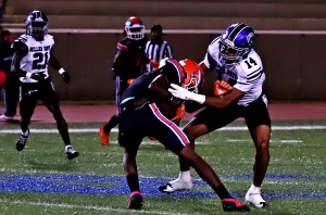 Columbia's Malek Gates (17) can't get away from Miller Grove's Zakih Camara. (Photo by Mark Brock)