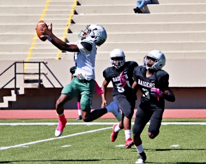 Freedom's Jamonte Sherman (5) makes a leaping catch in front of Redan's Benjamin Jackson (3) during Freedom's first round loss to Redan. (Photo by Mark Brock)