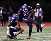 Miller Grove's Ahmed Jatta (42) kicks a PAT out of the hold of Thomas Winston IV (1) in a win over Redan earlier this season. The pair look to teammate several times in their key Region 6-2A match up with South Atlanta tonight (Friday, Oct. 18). (Photo by Mark Brock)