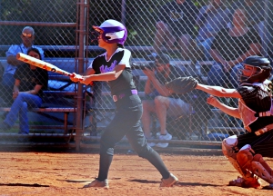 Miller Grove's Joy Choe fouls off a pitch as she battles her way to a walk during the Wolverines' 9-1 win in game 1 against Thomson. (Photo by Mark Brock)