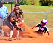 Miller Grove's Mariah Presley slides safely into second on steal as Thomson shortstop Kendyl Reynolds awaits a throw. Miller Grove went on to win the opening game 9-1. (Photo by Mark Brock)