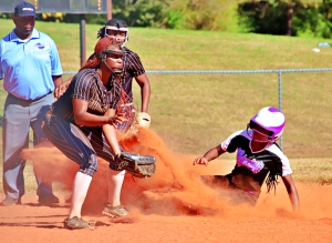 Miller Grove's Mariah Presley slides safely into second on  steal as Thomson shortstop Kendyl Reynolds awaits a throw. Miller Grove went on to win the opening game 9-1. (Photo by Mark Brock)