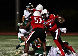 Stone Mountain quarterback Braydon Surprisse (1) runs behind a block from teammate Jaquan Morris (51). (Photo by Mark Brock)