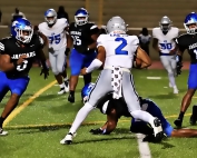 Stephenson middle linebacker Romando Craddock (0) and teammate Altariq Smith (11) corner North Clayton quarterback Justin Murphy (2) for a big loss on third and goal. (Photo by Mark Brock)