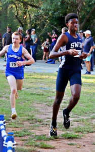 Southwest DeKalb's Amari Scott (right) nipped Chamblee's Ian Matthews by just 0.20 of a second to win the boys' individual title. (Photo by Mark Brock)