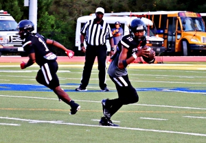 Towers quarterback Quaricus Hurley leads the Titans against the McNair Mustangs on Thursday night. The teams are tied at 11-11 in the series as they get set to play for the 23rd time. (Photo by Mark Brock)