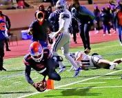 Columbia quarterback Cameron Graves dives to the pylon for a game-tying touchdown in the fourth quarter against Pierce County. (Photo by Mark Brock)