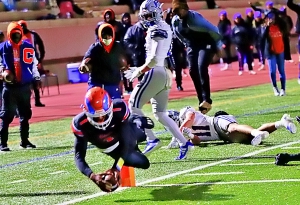 Columbia quarterback Cameron Graves dives to the pylon for a game-tying touchdown in the fourth quarter against Pierce County. (Photo by Mark Brock)