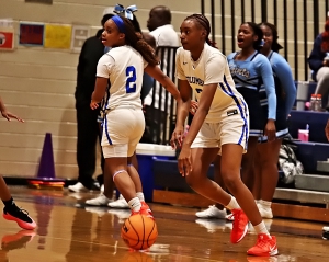 Columbia's Aalon Turner (3) looks to penetrate against the Cedar Grove defense as teammate De'Asia Kelly cuts to the basket during Columbia's 59-27 home court victory on Tuesday night. (Photo by Mark Brock)