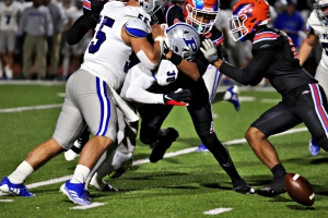 Columbia's Cain Jefferson (9) knocked the football loose from Pierce County running back Dylan Johnson. The loose football was scooped up by Columbia's Charles Harris for a 78-yard fumble return for a touchdown. (Photo by Mark Brock)