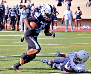 Cedar Grove's D'Mani Bent (6) scores a touchdown in the Saints 30-0 championship game win over Redan. (Photo by Mark Brock)