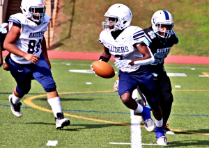 Redan's Benjamin Jackson (3) eludes Cedar Grove defender Zyan Allison (55) during Redan's first ever Trail to the Title Championship appearance. (Photo by Mark Brock)