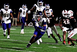 Southwest DeKalb receiver Jordan Christie (1) cuts up field on the way to 24-yard touchdown reception during the Panthers 48-14 Region 5-4A win over Druid Hills. The Panthers sewed up second place and a home game in the state playoffs. (Photo by Mark Brock)