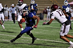 Southwest DeKalb's Jodan Christie (1) caught 10 passes for 78 yards, rushed for 46 yards on three carries and returned a kickoff 76 yards for a touchdown in the Panthers 35-13 playoff loss to Benedictine. (Photo by Mark Brock)