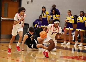 Dunwoody's Emerson Mitchell (1) heads up the court following a steal late in the fourth quarter of the Wildcats 42-37 Region 4-5A win over the Lakeside Vikings. Mitchell hit seven of eight free throws in the fourth quarter to help rally Dunwoody to the win. (Photo by Mark Brock)