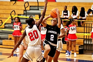 Lakeside's Alani Hill (2) goes up for a layup as Dunwoody's Makayla Tarver (20) defends during first half action of Lakeside's 68-22 road win. (Photo by Mark Brock)