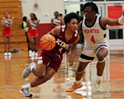 Martin Luther King's Caleb Winfrey (left) gets an opening against Stone Mountain's Vonte Edwards (right) during the Lions road win. (Photo by Mark Brock)