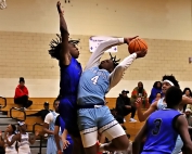 Cedar Grove's Donterious Stringfield Jr. goes up for a layup against Stephenson defenders Michel Gibson during the Saints 79=61 Region 5-3A win at home on Tuesday night. (Photo by Mark Brock)