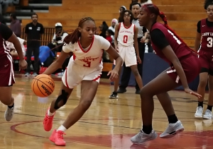 Stone Mountain's Dalys Monfait (3) drives against Mrartin Luther King's Kaleah Gibson (14) during the Lady Pirates win over the Lady Lions. (Photo by Mark Brock)